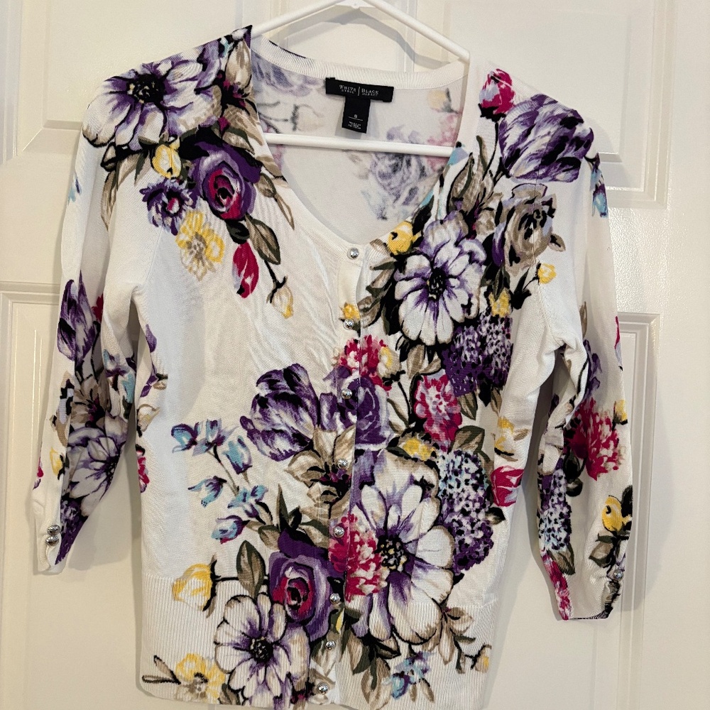 White House Black Market form fitting waist length button up cardigan.